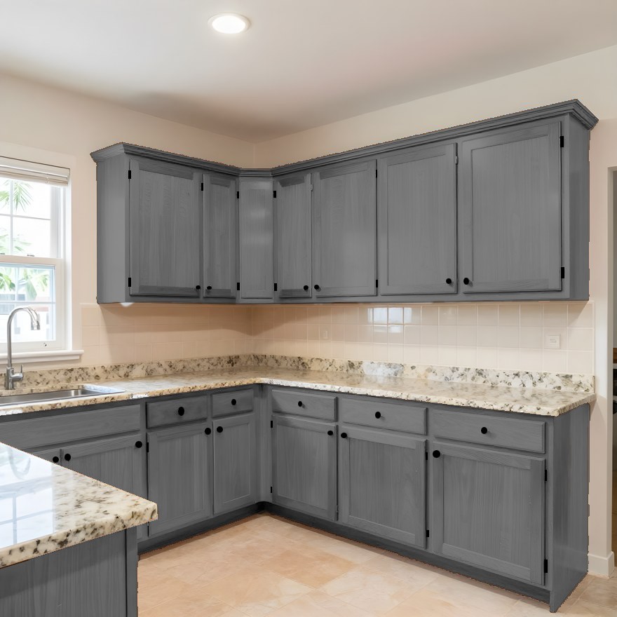 The same kitchen with the cabinetry painted grey and the hardware replaced